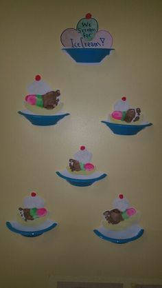 a refrigerator with magnets on the wall and an ice cream sundae in it