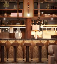 an image of a bar with stools in front of it and lights above the bar