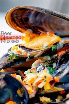 a close up of a plate of food with mussels