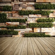 an empty wooden floor with grass growing on the wall and wood planks in front of it