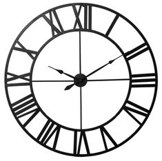 a black and white clock with roman numerals on it's face is shown