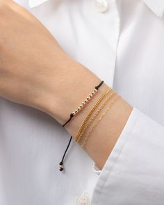 Choose your color, choose your fortune - the 14k gold bead row fortune bracelet is here to bring you good vibes! Each color has its own meaning, so why not mix and match? This cute and versatile bracelet is a must-have for your everyday looks! Adjustable length to fit most wrists: 6.5"- 8" Cord: Nylon Standard Production: 4-7 business days Rush Order Production: 2-5 business days Shipping: Select shipping method at checkout. Shipped from our L.A. Studio. Red Baby, Personalized Necklace, Gold Beads, Ring Bracelet, Mix And Match, Gold Black, Black And Navy, Everyday Look, Good Vibes