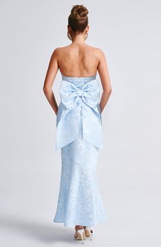 THE maxi of the season has landed and you're going to be obsessed. Meet Felicity, our dreamy dress with a pretty fit and flare skirt and waist cinching bodice. This strapless style is complete with lace up and an oversized bow to the back for perfect feminine drama.     Colour: Blue.  Premium non-stretch floral jacquard.  Fully lined.  Strapless design.  Waist cinching.  Detachable, oversized bow detail to back.  Fit and flare shaped skirt.  Lace up to the reverse.  Invisible zipper.  Maxi lengt Homecoming 2024, Babyboo Fashion, Dress To Jumpsuit, Split Long Dress, Fit And Flare Skirt, Fashion Dresses Online, Maxi Dress Sale, Maxi Dress Navy, Dreamy Dress