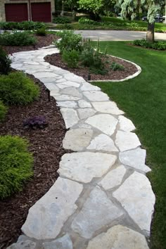 a stone path in front of a house