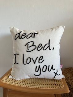 a pillow that says dear bed, i love you