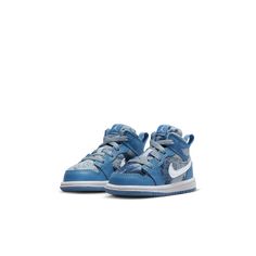 Your kiddo is all about summertime fun, and these Jordan 1s will bring the sunshine. Comfy and durable, the leather and tie-dye denim upper is built to last. A pull tab makes on-and-off extra easy so your little one can spend less time getting ready and more time playing outside.Leather and denim in the upper add durability.Soft, flexible midsole is lightweight and cushiony.Rubber outsole provides traction on a variety of surfaces.Pull tab at the collar makes it easy to put 'em on and take 'em o