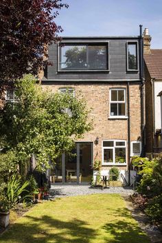 a brick house with an open front yard