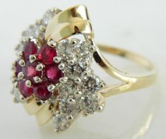 Here is a wonderful 14K gold diamond and ruby ring. This ring has incredible shine and eye appeal. The combination of the gold along with the stones really make this ring stand out. This is the perfect ring for someone who wants a timeless, vintage piece. Ring: 14K Gold Stones: 1.60 carats of Diamonds, Rubies Size: 8 Marked: 14K Weight: 9.4 grams SKU#20CB81917 If you have any questions on this item, please message us! GandDJewelers.etsy.com For ring sizing, please contact us for information. Ple Red Cluster Diamond Ring In 14k Gold, Red Diamond Cluster Ring In 14k Gold, Cluster Ruby Rings With Diamond Accents, Ruby Cluster Rings With Diamond Accents, Fine Jewelry Red Diamond Ring Stamped 14k, Classic Red Multi-stone Cluster Ring, 14k Gold Red Multi-stone Cluster Ring, Anniversary Red Cluster Ring Stamped 14k, Red Diamond Cluster Ring Stamped 14k