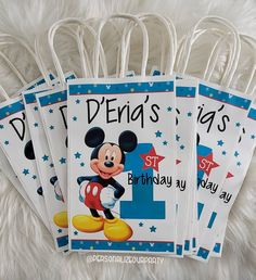 three mickey mouse birthday tags with the number one on them and stars in the background