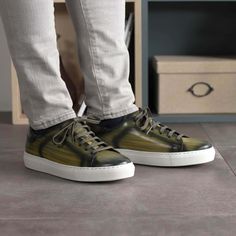 Elevate your sneaker game with our Khaki Patina Trainer. Handcrafted to perfection, this bespoke sneaker combines timeless style with modern comfort. Key Features: Materials: Crafted from exquisite khaki patina leather, known for its unique character and style. Sole: Designed with a white cupsole rubber sole, offering a blend of durability and flexibility. The Epitome of Casual Elegance: The cupsole trainer is a classic in men's footwear, and our bespoke version takes it to the next level. Its s Bryn Mawr, Leather Hardware, Loafer Sneakers, Sneaker Games, Trainer Sneakers, Jodhpur, Monk Strap, Casual Elegance, Color Khaki