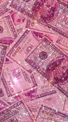 pink dollar bills with glitter on them are all over the place in this photo,