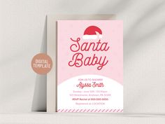 a pink and white baby shower with santa hat on it