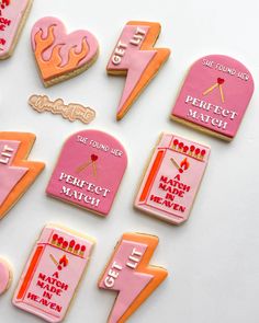 some pink and orange decorated cookies on a white surface with words that read perfect match