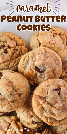 a pile of cookies sitting on top of a white plate with the words caramel peanut butter cookies