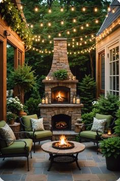 an outdoor fireplace surrounded by patio furniture and string lights