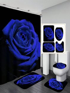 a bathroom with blue roses on the shower curtain and rugs in front of it