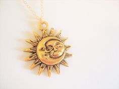 A gold half moon is wrapped around a sun with sun rays all about. Such a neat pendant to wear with the sun rising in the back and the crescent moon wrapped around the sun. Chain is a strong gold plated chain. You can select your desired length at checkout. Sun moon charm measures 1' You can select your length at checkout. Enter back into store: rhondastreasures.etsy.com RhondasTreasures Gold Sun And Moon Design Jewelry For Festivals, Gold Necklace With Sun And Moon Design For Festival, Gold Jewelry With Sun And Moon Design For Festivals, Gold Sun And Moon Necklace For Festivals, Gold Moon Necklace For Festivals, Gold Crescent Necklace For Festivals, Gold Sun And Moon Festival Jewelry, Bohemian Gold Necklaces With Sun And Moon Design, Mystical Gold Necklace With Sun And Moon Design