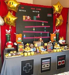 a nintendo themed birthday party with balloons and decorations