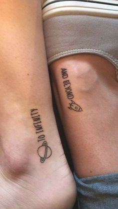 two people with matching tattoos on their legs, one is holding the other's arm