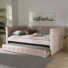 a bed with a pull out trundle in a room