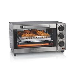 a silver toaster oven with food in it