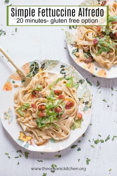 two plates filled with pasta and garnished with herbs on the side, text overlay reads simple fettuccine alfredo