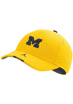 This Michigan Wolverines Yellow Adjustable Hat features a front embroidered team logo on a structured Dri-Fit polyester crown. Nike Sideline L91 Dri-Fit Hat, Front embroidered team logo, Performance Dri-Fit polyester material, Strategic crown perforations to help keep cool, Swoosh on bill, As worn by teams on the sidelines, Polyester, Wipe clean with cloth or cleaning kit, 4 Nike Baseball Cap With Curved Brim For Sports, Nike Curved Brim Baseball Cap For Sports, Nike Sporty Trucker Hat For Sports, Nike Breathable Baseball Cap, Sports Baseball Cap In Team Colors With Curved Brim, Collegiate Sports Trucker Hat With Curved Brim, Collegiate Baseball Cap For Sports, Collegiate Sports Baseball Cap With Curved Visor, Collegiate Trucker Hat With Curved Brim For Sports