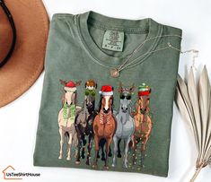 Comfort Colors® Horse Christmas Shirt, Western Christmas Horse Shirt, Womens Christmas Sweater, Funny Christmas Shirt, Horse Lover Gift -Sizing and Color Guidelines- We use Comfort Colors Heavyweight brands t-shirts for all the listings where you see Comfort Colors in the title. The shirts are Unisex size. They are meant to be loose-fitting, so ordering one size smaller is recommended if you want a tighter fit. Each of our shirts is meticulously crafted to your specifications, making returns or Christmas Tshirts For Women Western, Christmas Horse, Horse Christmas, Christmas Horses, Christmas Sweaters For Women, Womens Christmas, Mom Sweater, Horse Shirt, Horse T Shirts