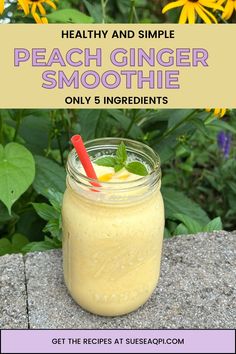 a mason jar filled with peach ginger smoothie on top of a stone table next to flowers