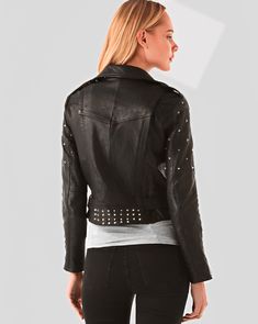 Women's Studded Biker Leather Jacket In Black This women's studded biker leather jacket is made from real leather and features two side zip pockets, notched collar with snap button closure, studs at the front and back. The belt on this jacket is black leather and it can be worn on either side. Outer Shell: Real Leather Leather Type: Cowhide Leather Finish: Semi-aniline Inner Shell: Viscose LiningWomen's Studded Biker Leather Jacket Features: Belted Waist & High-Quality Studs. Each Securely Added By Hand Closure Style: Zipper Collar Style: Notch Collar With Snap Button Cuffs Style: Zip Inside Pockets: One Outside Pockets: Two Side Zip Pockets Color: Black Fitted Biker Outerwear With Studs, Edgy Studded Biker Jacket For Winter, Fitted Biker Jacket With Studs For Fall, Fitted Studded Biker Jacket For Fall, Fall Fitted Studded Biker Jacket, Studded Fitted Biker Jacket For Fall, Rocker Leather Jacket With Studs For Biker Events, Rocker Style Studded Leather Jacket For Biker Events, Rock Style Studded Fitted Outerwear