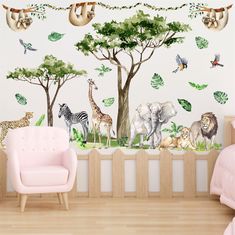 a wall with animals and trees painted on it in a child's nursery room