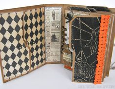 an open book with black and white designs on the pages is shown in close up