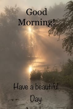 the words good morning have a beautiful day are in front of a river with sunbeams