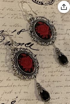 Halloween ‘23 trends and inspo pop of red rose spooky seasom goth vampire earrings Rose Metal Jewelry For Party, Antique Black Dangle Jewelry, Formal Silver Earrings With Rose Design, Silver Earrings With Rose Design For Formal Events, Silver Rose Design Earrings For Formal Occasions, Gothic Rose-colored Jewelry For Gifts, Gothic Rose Colored Jewelry For Gift, Gothic Rose Jewelry For Gift, Rose-colored Gothic Jewelry For Gift