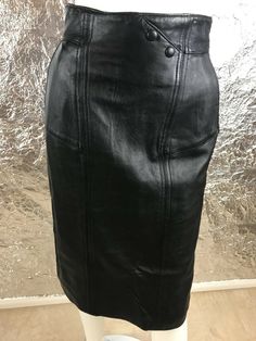 Women's vintage 1980's genuine black fitted leather high waist pencil skirt with back zipper.  Has side front pockets, full lining, and a back slit.  Size 8 (vintage sizing runs smaller than modern sizing) or small to medium, has NO stretch.  Pre-owned.  Good vintage condition.  WAIST=26 inches.  HIPS=36 inches.  ZIPPER LENGTH=9 inches.  SLIT LENGTH=8 inches.  LENGTH=26 inches. High Waist Pencil Skirt, High Waisted Pencil Skirt, Black High Tops, Black Pencil Skirt, Hair Colorist, 1980s Vintage, Black Fits, Leather Top, Leather Skirt