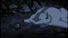 an animated image of a bear laying on the ground