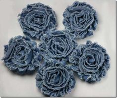 several pieces of blue fabric with flowers on them