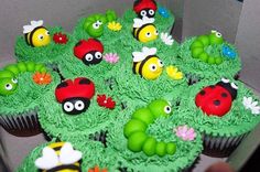 cupcakes decorated with green frosting and ladybugs