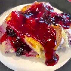 a piece of crepe with blueberry sauce on it