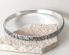 This is a cute bracelet. This patterned bangle is made with heavy gauge sterling silver. The bangle shown is 2.5 inches in diameter and will fit most wrists. It is also available 2.25, 2.75 and 3 inches in diameter. It is also available not oxidized: https://www.etsy.com/listing/471375282 How to measure your hand for a bangle: Make your hand as small as possible, as if you were putting on bangles, bringing your thumb and little finger together. 2. Using the tape measure (or string), measure the Adjustable Silver Bohemian Bangle, Bohemian Antique Silver Metal Bangle, Bohemian Nickel-free Sterling Silver Bangle Bracelet, Vintage Silver Hallmarked Bangle, Vintage Sterling Silver Nickel-free Bangle, Bangles Making, Sterling Silver Bangles, Cute Bracelets, Oxidized Sterling Silver