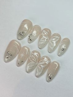 ig & tt: angelisnailstudio White Butterfly Nail Designs, Butterfly Outline Nails, Snow Angel Nails, Angel Nails Halloween, Angel Themed Nails, Sparkle Butterfly Nails, White Angel Nails, White Gel Nails With Design, Angel Nails Designs