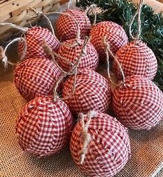 some red and white ornaments are sitting on a table