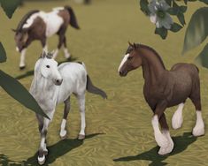 two horses are standing in the grass near some trees and flowers, one horse is white with brown spots