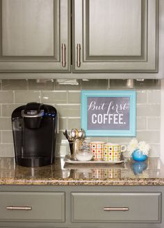 the coffee station is on the counter in the kitchen