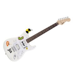 an electric guitar with stickers all over it's body, neck and head