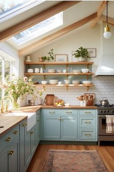 a kitchen filled with lots of counter space next to a stove top oven under a skylight