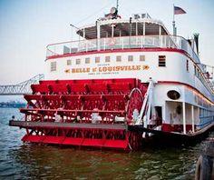 a large red and white boat in the water