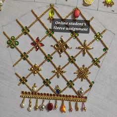 several different types of necklaces are displayed on a table with a sign that says online student's slave assignment