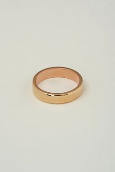 Our most popular mens band. The two tone band is composed of a 14k yellow gold exterior, with a 14k rose gold interior in a slight comfort fit. When worn the band has a slight glistening rim of rose gold on the edge.  We prefer this band in a 5mm - 6mm width for a skinnier more comfortable fit.  Hammered exterior textu 14k Rose Gold Bands With Polished Finish, 14k Rose Gold Polished Bands, Classic Wide Band Rose Gold Ring With Polished Finish, Classic Rose Gold Wide Band Ring With Polished Finish, Classic Rose Gold Wide Band Ring, Classic Rose Gold Wedding Ring With Decorative Band, Classic Pink Gold Ring, Rose Gold Polished Finish Band For Promise Ring, Rose Gold Bands With Polished Finish For Promise Ring