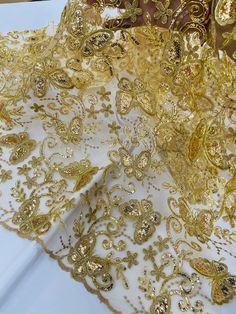 gold sequins and lace on a white table cloth